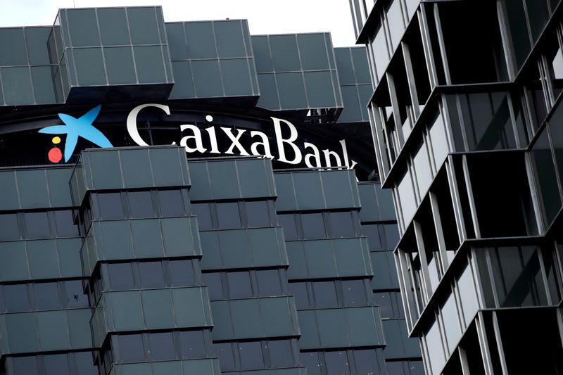 &copy; Reuters. FILE PHOTO: CaixaBank's logo is seen on top of the company's headquarters in Barcelona, Spain, September 17, 2020. REUTERS/Albert Gea/File Photo