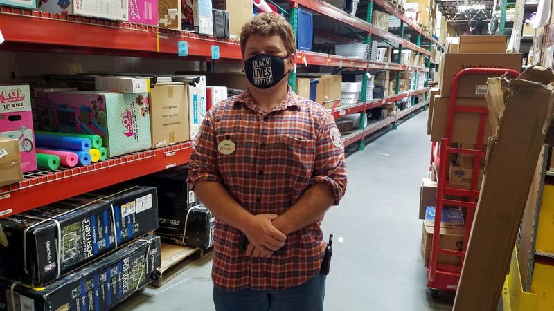 &copy; Reuters. FILE PHOTO: Target worker Adam Ryan stands in the stockroom of his store in Christiansburg, Virginia, U.S. May 10, 2021. Adam Ryan/Handout via REUTERS   