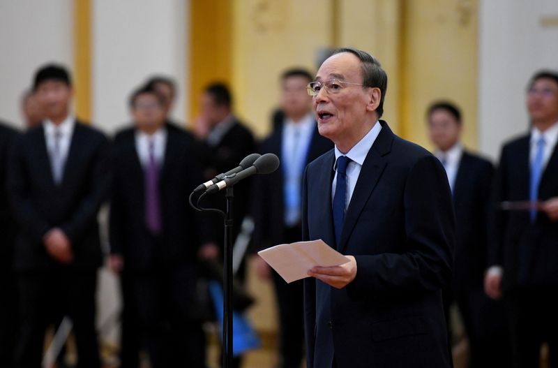 &copy; Reuters. FILE PHOTO: China's Vice President Wang Qishan talks to the representatives of the China-Russian Committee for Peace and Development at the Great Hall of the People in Beijing, China December 5, 2019.  NOEL CELIS/Pool