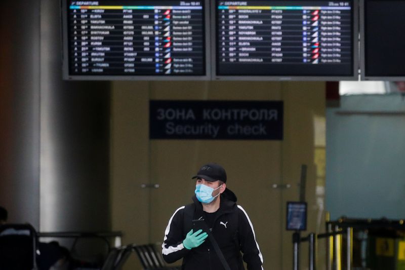 &copy; Reuters. A man passes by at Vnukovo International Airport amid the outbreak of the coronavirus disease (COVID-19) in Moscow, Russia May 22, 2020. REUTERS/Maxim Shemetov