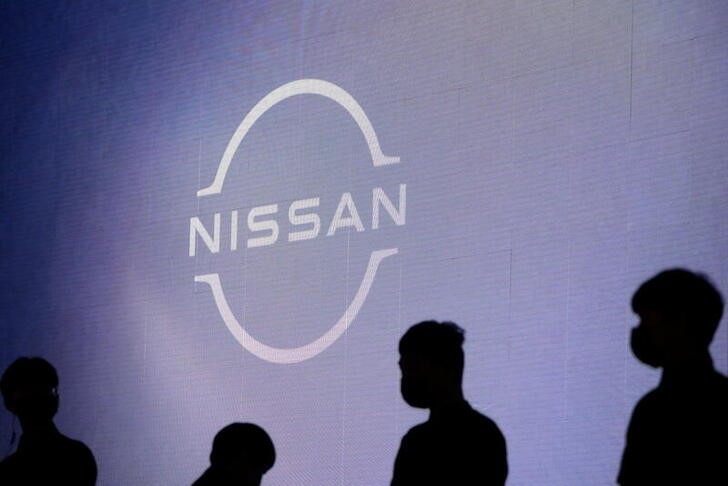 &copy; Reuters. People stand near the Nissan logo during a media day for the Auto Shanghai show in Shanghai, China April 20, 2021. REUTERS/Aly Song