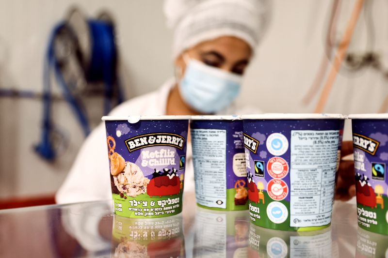 &copy; Reuters. Tubs of ice-cream are seen as a labourer works at Ben & Jerry's factory in Be'er Tuvia, Israel July 20, 2021. REUTERS/Ronen Zvulun