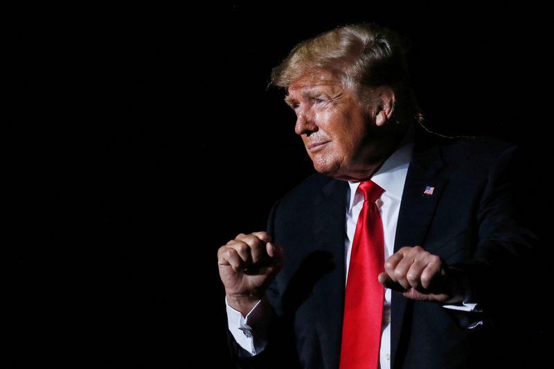 &copy; Reuters. FILE PHOTO: Former U.S. President Donald Trump reacts after his speech during a rally at the Iowa States Fairgrounds in Des Moines, Iowa, U.S., October 9, 2021. REUTERS/Rachel Mummey/File Photo