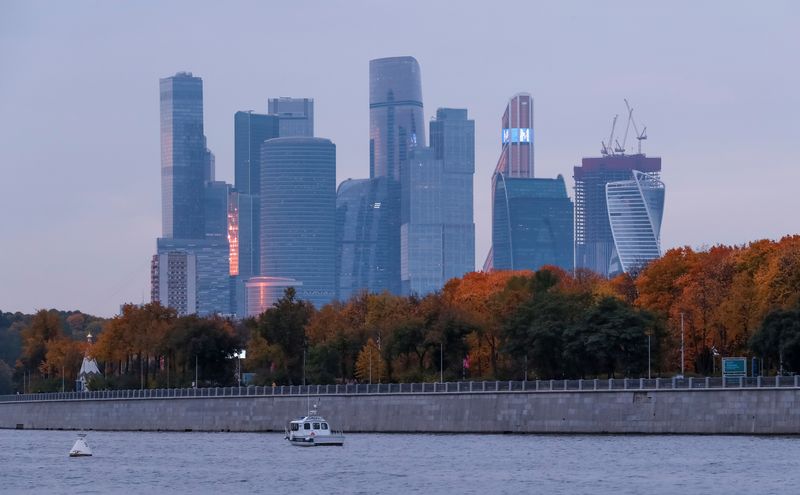 &copy; Reuters. A boat sails on the Moskva River with an embankment in autumn-coloured trees with backdrop of the Moscow International Business Centre, also known as "Moskva-City", in Moscow, Russia October 4, 2021.  REUTERS/Shamil Zhumatov