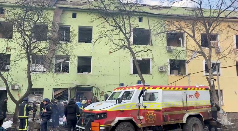 &copy; Reuters. Emergency services are seen on site of the destroyed Mariupol children's hospital as Russia's invasion of Ukraine continues, in Mariupol, Ukraine, March 9, 2022 in this still image from a handout video obtained by Reuters. Ukraine Military/Handout via REU