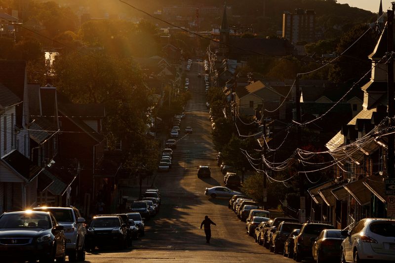 &copy; Reuters. FILE PHOTO: A pedestrian crosses a street in the Northampton County city of Bethlehem, Pennsylvania, U.S., October 1, 2020.  REUTERS/Brian Snyder/File Photo