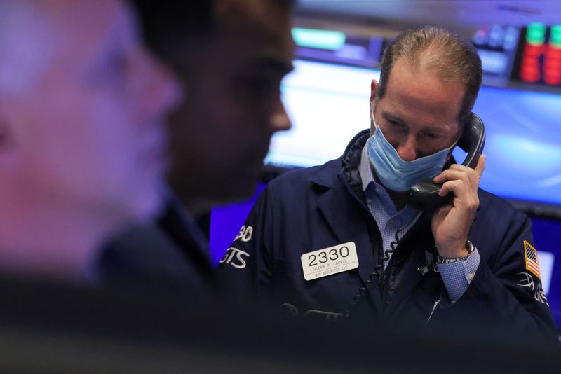 Wall Street slumps in broad swoon to end bumpy week