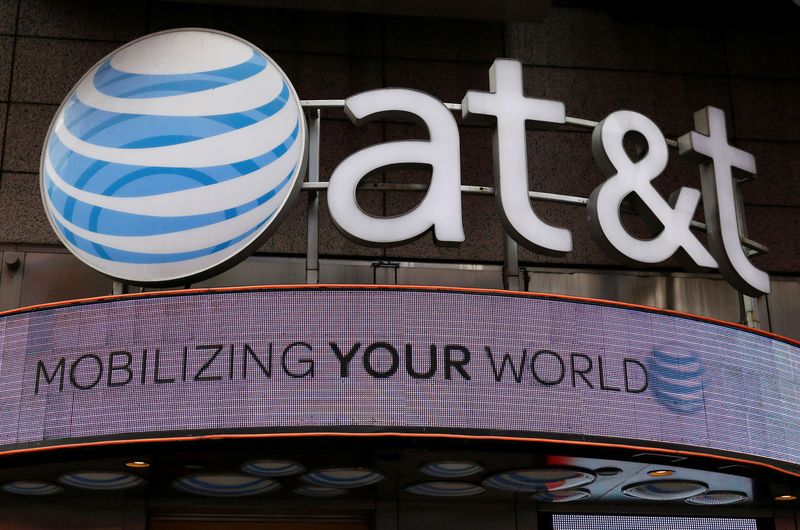 &copy; Reuters. FILE PHOTO: Signage for an AT&T store is seen in New York October 29, 2014.  REUTERS/Shannon Stapleton