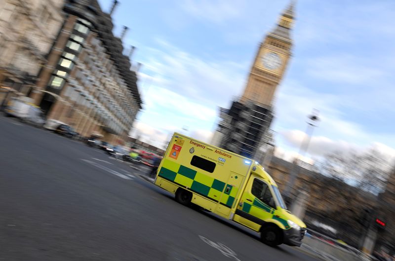 &copy; Reuters. An ambulance is driven past the Houses of Parliament as it attends an emergency call, amidst the spread of the coronavirus disease (COVID-19) pandemic, in London, Britain, January 28, 2022. REUTERS/Toby Melville/File Photo