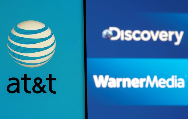 &copy; Reuters. FILE PHOTO: AT&T logo is seen on a smartphone in front of displayed Discovery and Warner Media logos in this illustration taken May 17, 2021. REUTERS/Dado Ruvic/