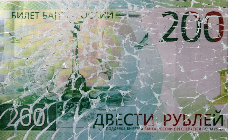 &copy; Reuters. FILE PHOTO: A Russian rouble banknote is seen through broken glass in this illustration taken March 1, 2022. REUTERS/Dado Ruvic/Illustration