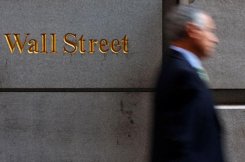 &copy; Reuters. FILE PHOTO: A man walks along Wall Street in New York September 18, 2008. REUTERS/Eric Thayer/File Photo