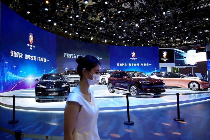 &copy; Reuters. FILE PHOTO: Evergrande Group's Hengchi electric vehicles (EV) are seen displayed at the Hengchi booth during a media day for the Auto Shanghai show in Shanghai, China April 19, 2021. REUTERS/Aly Song