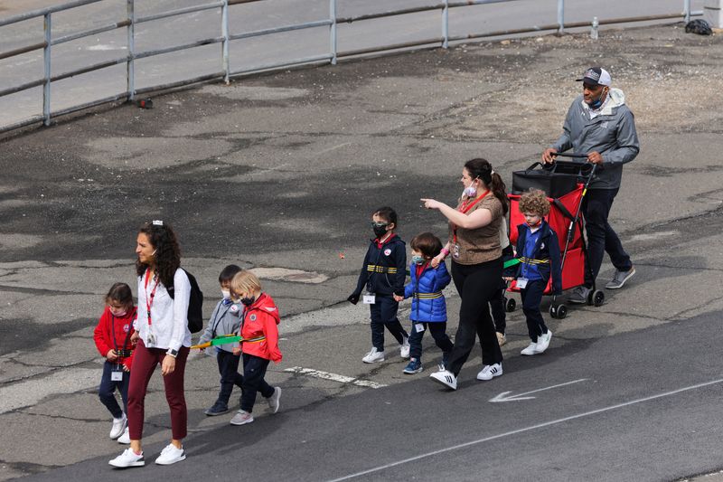 &copy; Reuters. FILE PHOTO: Children are seen walking, on the first day of lifting the indoor mask mandate for DOE schools between K through 12, in Manhattan, New York City, New York, U.S., March 7, 2022. REUTERS/Andrew Kelly