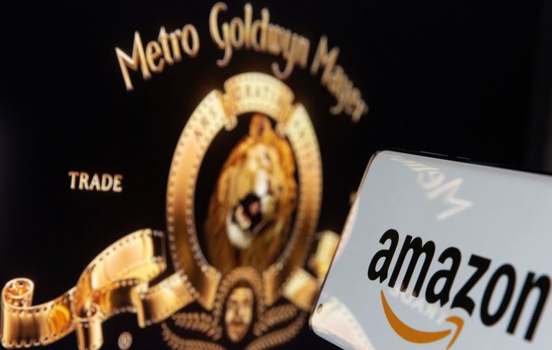 &copy; Reuters. Smartphone with Amazon logo is seen in front of displayed MGM logo in this illustration taken, May 26, 2021. REUTERS/Dado Ruvic/Illustration