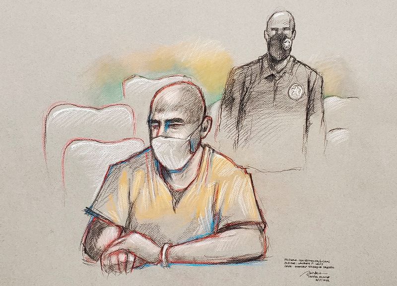 © Reuters. Former Proud Boys chairman Enrique Tarrio sits near a U.S. Marshal during a hearing at federal court in Miami, Florida, U.S. March 15, 2022 in a courtroom sketch.  REUTERS/Daniel Pontet