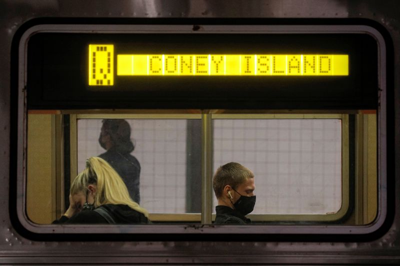 &copy; Reuters. FILE PHOTO: Passengers ride aboard the MTA's New York City Transit subway, in New York, U.S., May 3, 2021.  REUTERS/Brendan McDermid/File Photo