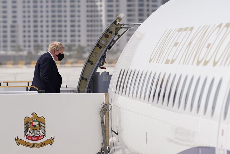 &copy; Reuters. British Prime Minister Boris Johnson boards his plane at Abu Dhabi Airport, for a trip to Riyadh, Saudi Arabia, following Russia's invasion of Ukraine, in Abu Dhabi, United Arab Emirates, March 16, 2022. Stefan Rousseau/Pool via REUTERS