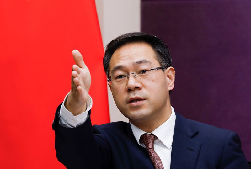 &copy; Reuters. Chinese Commerce Ministry spokesman Gao Feng gestures during a news conference in Beijing, China January 29, 2021. REUTERS/Tingshu Wang/Files