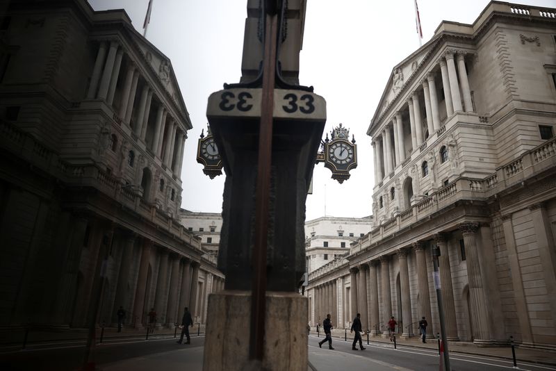 &copy; Reuters. FILE PHOTO: A person walks past the Bank of England in the City of London financial district in London, Britain, January 23, 2022. REUTERS/Henry Nicholls