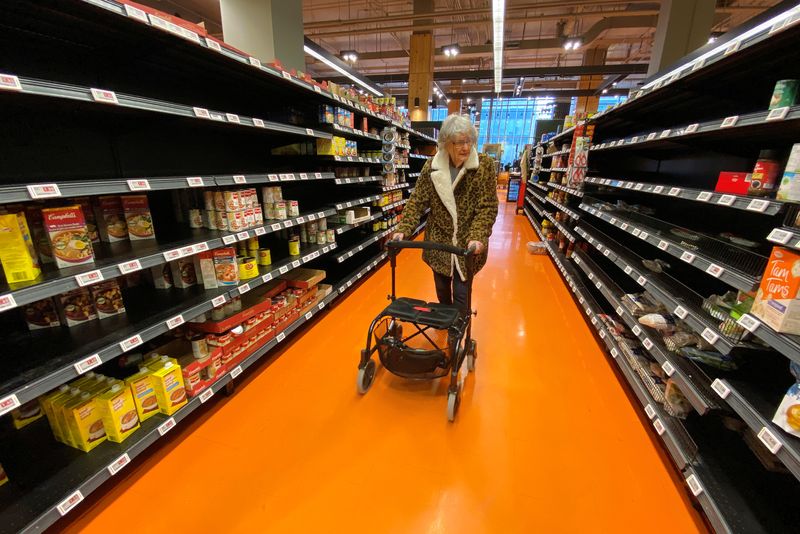 &copy; Reuters. FILE PHOTO: A shopper walks through an aisle empty of pasta, rice, beans and soup, amid an atmosphere of growing numbers of coronavirus cases, at a Loblaws supermarket in Toronto, Ontario, Canada March 14, 2020.  REUTERS/Chris Helgren