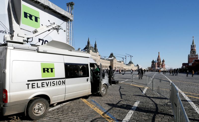 &copy; Reuters. FILE PHOTO: Vehicles of Russian state-controlled broadcaster RT are seen in Red Square in central Moscow, Russia, March 18, 2018. REUTERS/Gleb Garanich