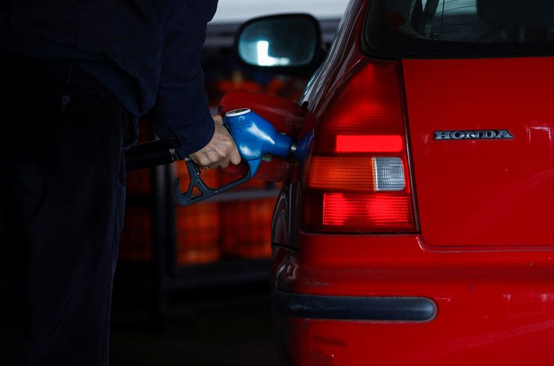 &copy; Reuters. FILE PHOTO: A man fills fuel at a service station during a significant increase in the price of energy in Madrid, Spain, March 8, 2022. REUTERS/Juan Medina