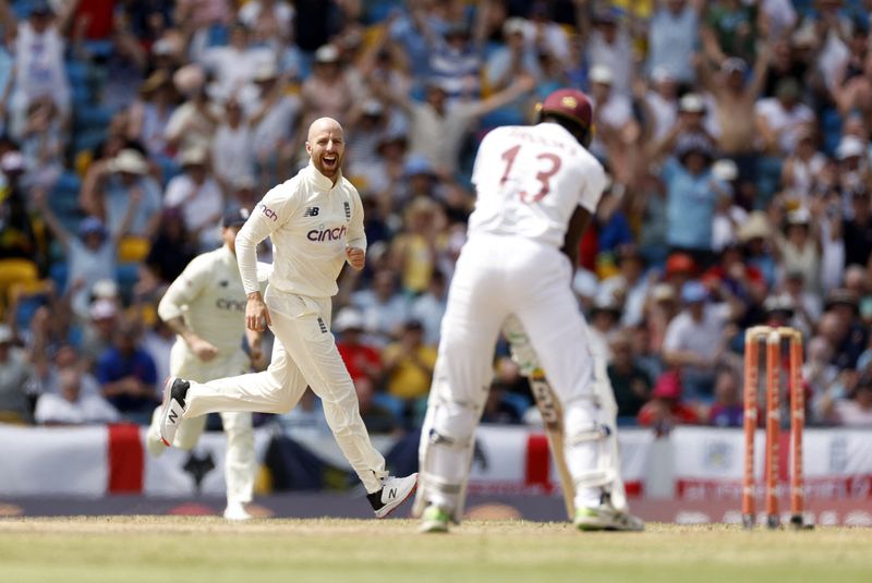 &copy; Reuters. Cricket - Second Test - West Indies v England - The Kensington Oval, Bridgetown, Barbados - March 18, 2022 England's Jack Leach celebrates after taking the wicket of West Indies' Shamarh Brooks Action Images via Reuters/Jason Cairnduff