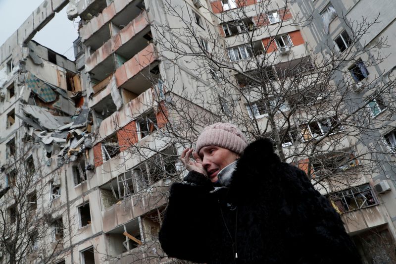 Dead buildings tower over uncollected corpses in Mariupol, on the front line of Ukraine's war