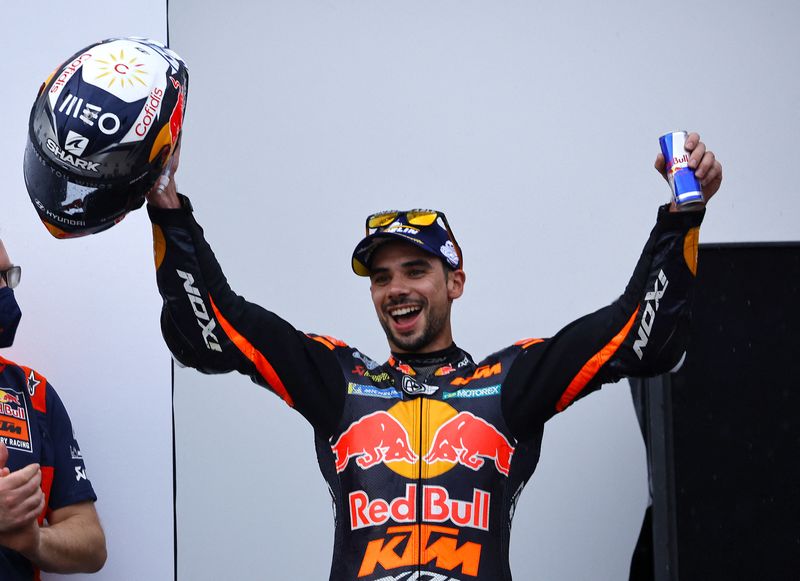 &copy; Reuters. MotoGP - Indonesian Grand Prix - Mandalika International Street Circuit, Kuta, Lombok, Indonesia - March 20, 2022 Red Bull KTM Factory Racing's Miguel Oliveira celebrates on the podium after winning the race REUTERS/Willy Kurniawan