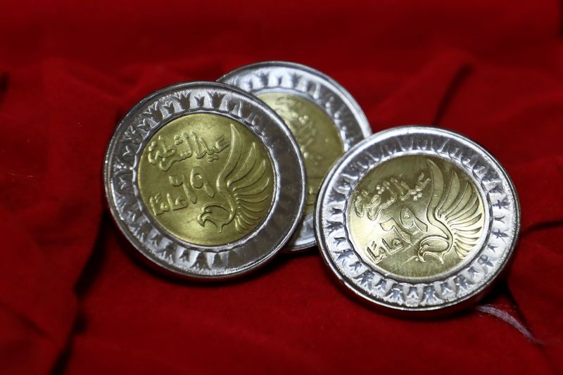 &copy; Reuters. FILE PHOTO: Coins of a one Egyptian pound are seen at the Mint Museum to mark police day which falls on January 25, the anniversary of the country's 2011 uprising, in Cairo, Egypt January 25, 2021. REUTERS/Amr Abdallah Dalsh