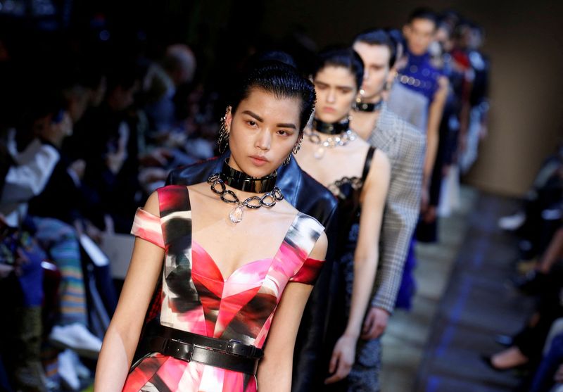 &copy; Reuters. FILE PHOTO: Models present creations by British designer Sarah Burton as part of her Fall/Winter 2019-2020 women's ready-to-wear collection show for fashion house Alexander McQueen during Paris Fashion Week, in Paris, France, March 4, 2019.  REUTERS/Regis