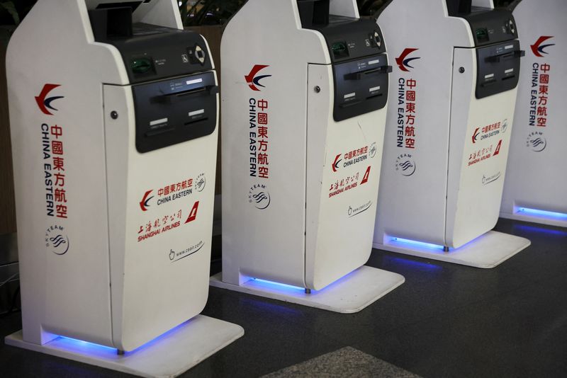 &copy; Reuters. Logos of China Eastern Airlines are pictured on check-in kiosks at Beijing Capital International Airport in Beijing, China March 21, 2022. REUTERS/Tingshu Wang