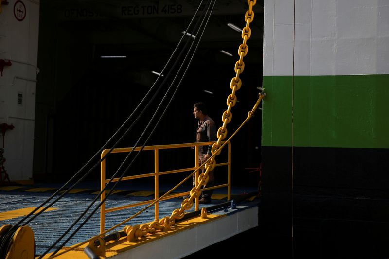 &copy; Reuters. FILE PHOTO: A seaman stands at the entrance of a moored passenger ferry during a 24-hour general strike at the port of Piraeus, Greece, June 16, 2021. REUTERS/Costas Baltas TPX IMAGES OF THE DAY
