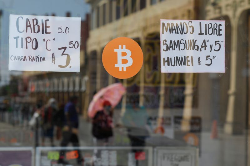 &copy; Reuters. FILE PHOTO: A Bitcoin sign is displayed outside a store where the cryptocurrency is accepted as a payment method in San Salvador, El Salvador, February 1, 2022. REUTERS/Jose Cabezas