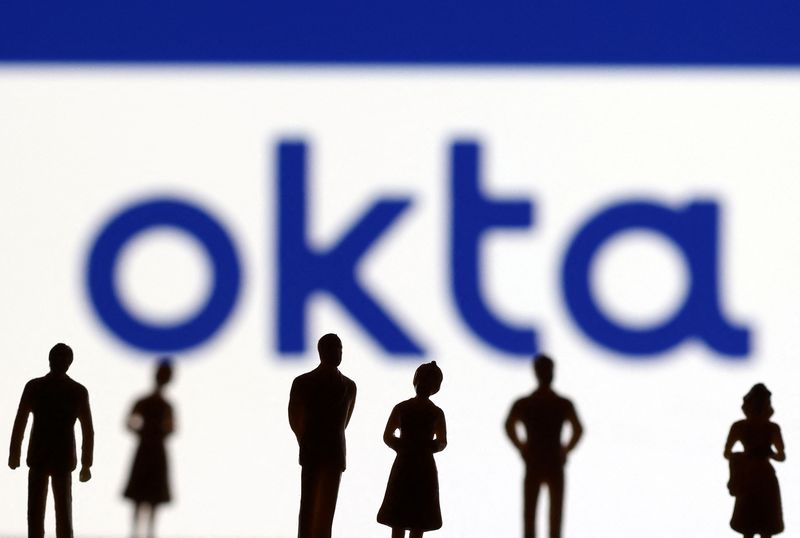 &copy; Reuters. FILE PHOTO: People's miniatures are seen in front of Okta logo in this illustration taken March 22, 2022. REUTERS/Dado Ruvic/Illustration