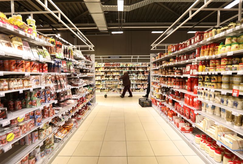 &copy; Reuters. FILE PHOTO: A customer is seen inside Albert Heijn shop, operated by Ahold Delhaize, the Dutch-Belgian supermarket operator, in Eindhoven, Netherlands, January 23, 2019. REUTERS/Eva Plevier