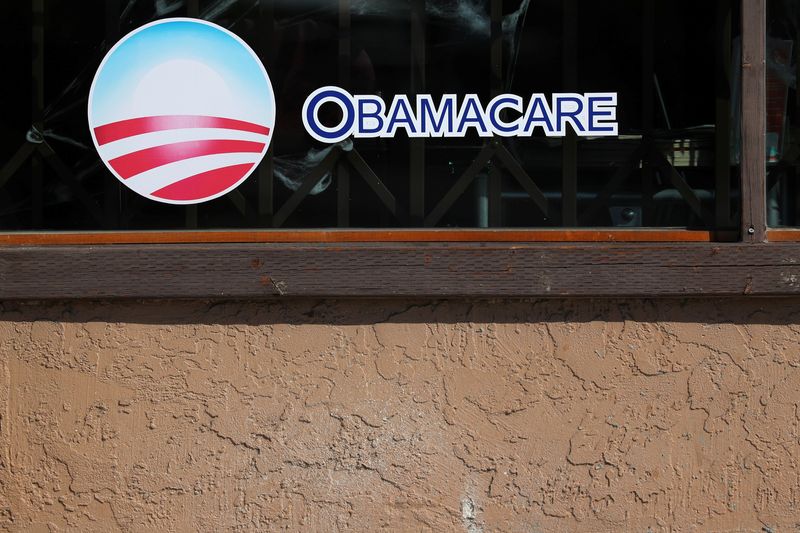 &copy; Reuters. FILE PHOTO: A sign on an insurance store advertises Obamacare in San Ysidro, San Diego, California, U.S., October 26, 2017. REUTERS/Mike Blake