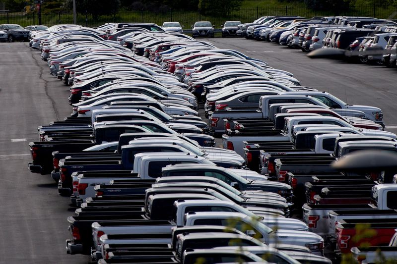 &copy; Reuters. FILE PHOTO: Cars unsold due to the autos market slowdown caused by coronavirus disease (COVID-19) are seen stored in the parking lot of the Wells Fargo Center in Philadelphia, Pennsylvania, U.S. April 28, 2020.  REUTERS/Mark Makela/File Photo