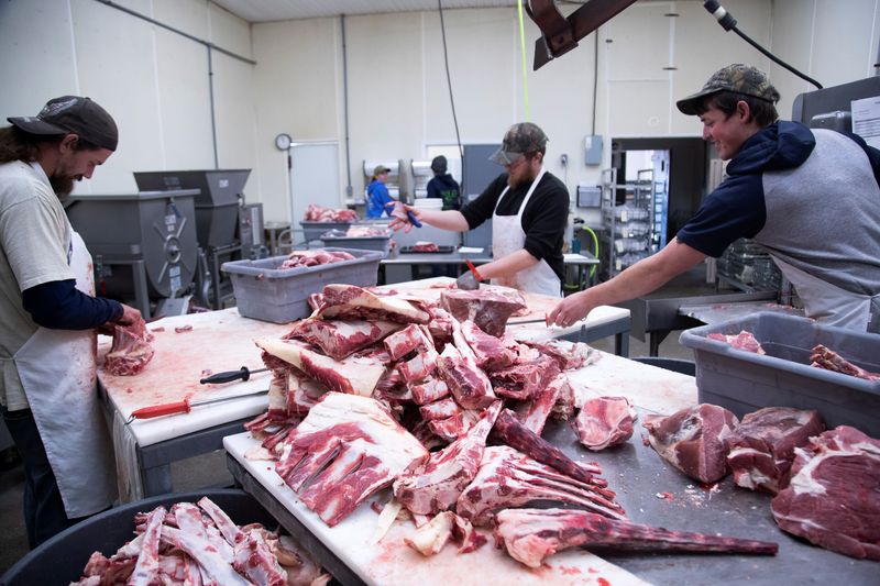 &copy; Reuters. FILE PHOTO: Employees cut fresh beef meat into small pieces at the First Capitol Meat Processing plant amid shortages of animal products due to supply chain issues created by the coronavirus disease (COVID-19) pandemic in Corydon, Indiana U.S. January 31,