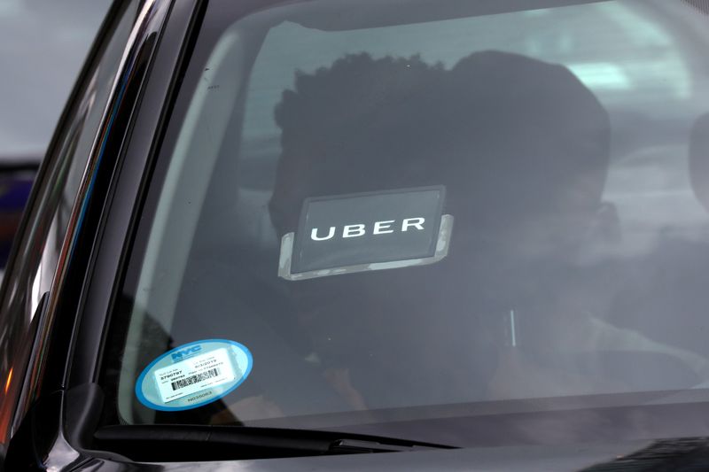 &copy; Reuters. FILE PHOTO: An Uber logo is seen on a car as it car drives through Times Square in New York City, New York, U.S., July 27, 2018. REUTERS/Mike Segar