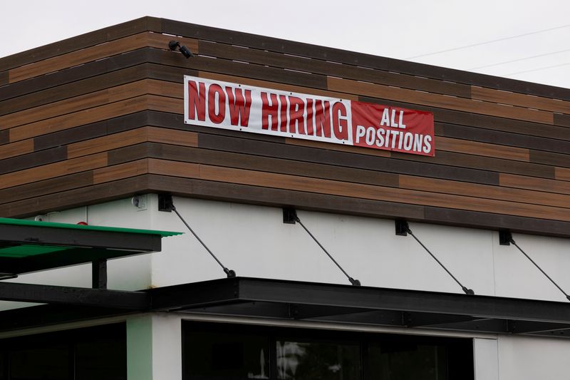 © Reuters. FILE PHOTO: A restaurant advertising jobs looks to attract workers in Oceanside, California, U.S., May 10, 2021. REUTERS/Mike Blake/