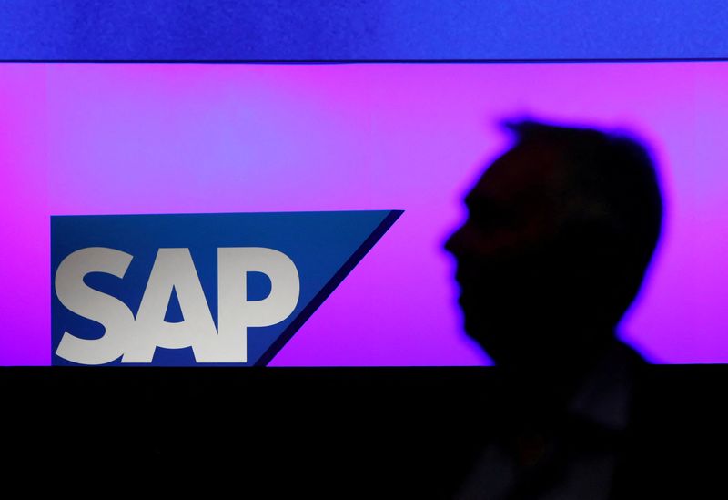 &copy; Reuters. FILE PHOTO: A man walks past a SAP logo during the company's annual general meeting in Mannheim, Germany, May 15, 2019. REUTERS/Ralph Orlowski