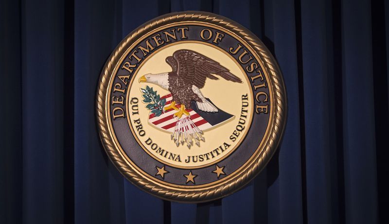 &copy; Reuters. FILE PHOTO: The Department of Justice (DOJ) logo is pictured on a wall after a news conference to discuss alleged fraud by Russian Diplomats in New York December 5, 2013.     REUTERS/Carlo Allegri  