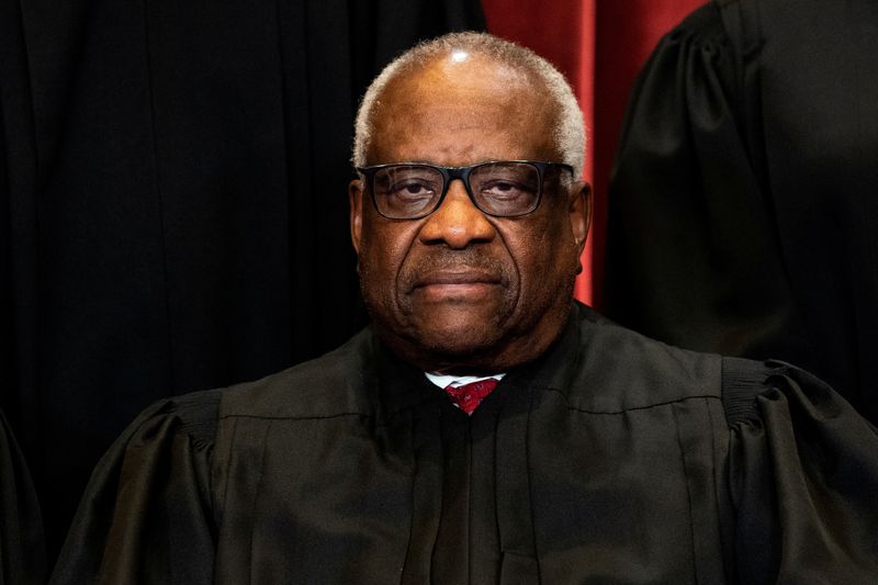 © Reuters. FILE PHOTO: Associate Justice Clarence Thomas poses during a group photo of the Justices at the Supreme Court in Washington, U.S., April 23, 2021. Erin Schaff/Pool via REUTERS/File Photo