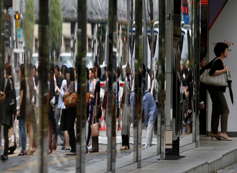 &copy; Reuters. FILE PHOTO: People are reflected in the windows of a dapartment store in a shopping district in Tokyo, Japan June 29, 2016. REUTERS/Toru Hanai