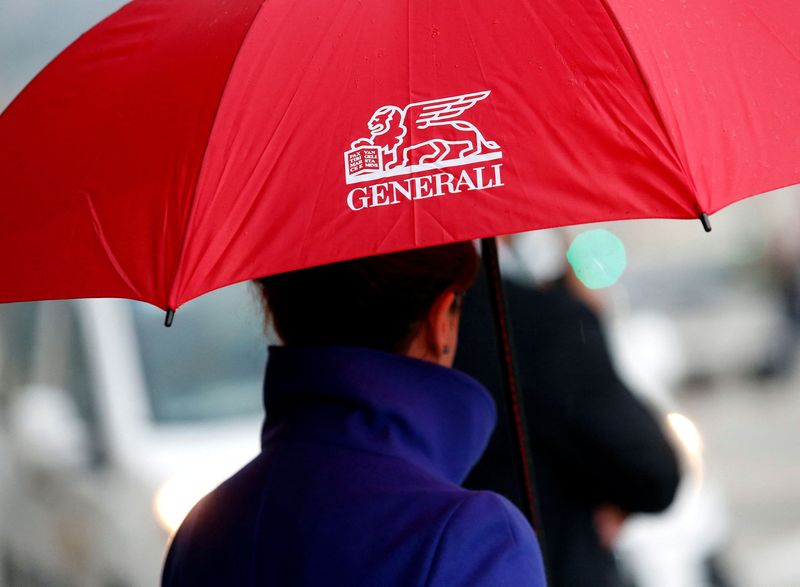© Reuters. FILE PHOTO: A woman holds an umbrella as she arrives at the Italian insurance company Generali shareholders meeting in Trieste, Italy, April 27, 2017. REUTERS/Remo Casilli