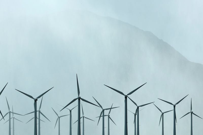 &copy; Reuters. FILE PHOTO: Wind turbines spin during a winter storm near Palm Springs, California, U.S., March 10, 2021.  REUTERS/Mike Blake