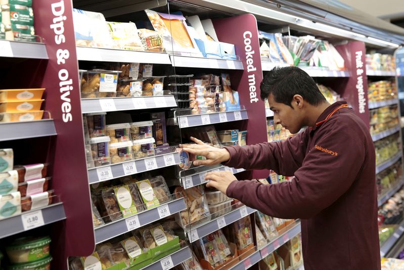 &copy; Reuters. FILE PHOTO: An employee stocks a shelf at a Sainsbury's Local store in central London, Britain October 23, 2015. REUTERS/Suzanne Plunkett/File Photo