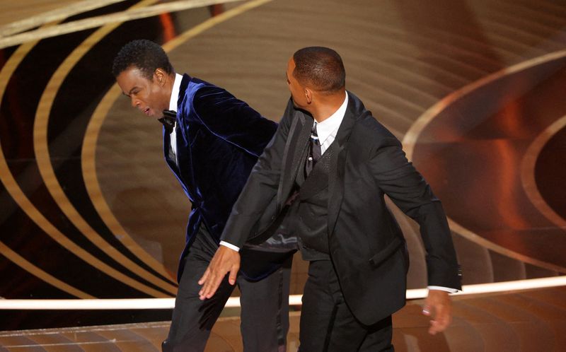 Will Smith smacks Chris Rock on stage, then apologizes upon winning Oscar